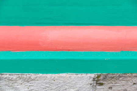 Textured surface of old stone weathered wall in the backyardの写真素材