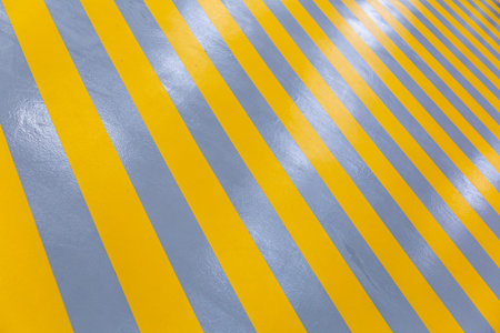 Yellow striped walkway for staff in the production workshop of an industrial plant
