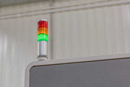 Multicolored lamp indicator of the operation of industrial equipment in a production workshopの写真素材
