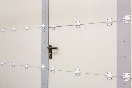Reinforced steel door in an industrial warehouse