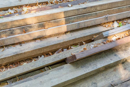 Heap of long wooden boards for the construction and improvement of the yardの写真素材