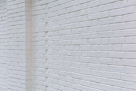 Embossed textured surface of an old wall made of facade bricks and cementの写真素材