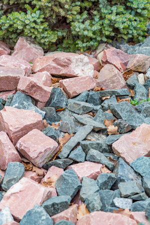 Untreated rough natural stone in everyday environment, gardening and landscaping