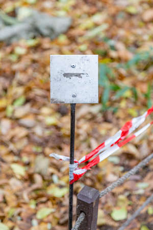 Iron street sign without signs and symbols during the dayの写真素材