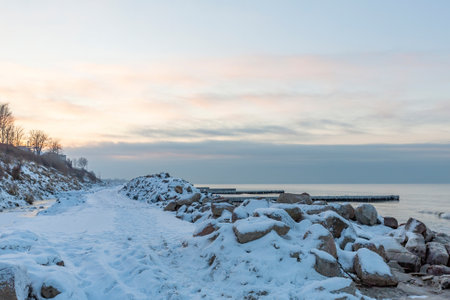 Winter seascape with Baltic Sea waters, horizon and cloudy sky in Kaliningrad region, Russiaの写真素材