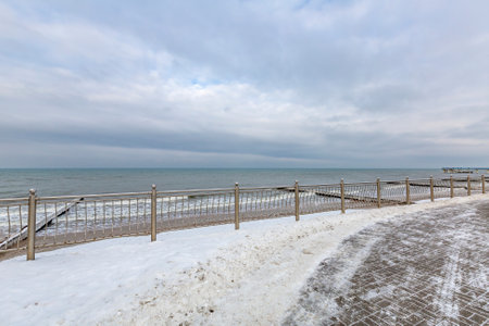 Winter seascape with Baltic Sea waters, horizon and cloudy sky in Kaliningrad region, Russiaの写真素材