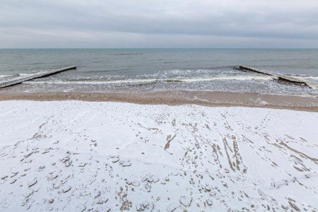 Winter seascape with Baltic Sea waters, horizon and cloudy sky in Kaliningrad region, Russiaの写真素材