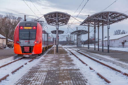 Zelenogradsk, Russia - January 14, 2021: Passenger train on an empty platform of the city railway stationのeditorial素材