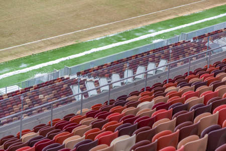 Moscow, Russia - March 14, 2021: Durable non-vandal plastic seats of the Luzhniki football stadium. Part of the tribune without peopleのeditorial素材