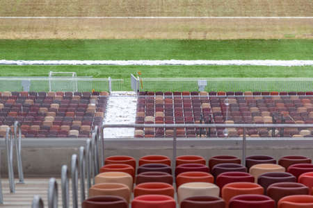 Moscow, Russia - March 14, 2021: Durable non-vandal plastic seats of the Luzhniki football stadium. Part of the tribune without peopleのeditorial素材