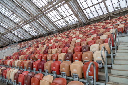 Moscow, Russia - March 14, 2021: Durable non-vandal plastic seats of the Luzhniki football stadium. Part of the tribune without peopleのeditorial素材
