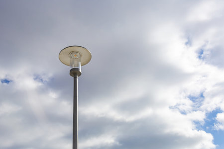 Vintage iron lantern in a public park in the daytimeの写真素材