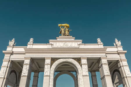 Moscow, Russia - March 20, 2021: Gate arch of the main entrance to VDNH. Built by 1954のeditorial素材