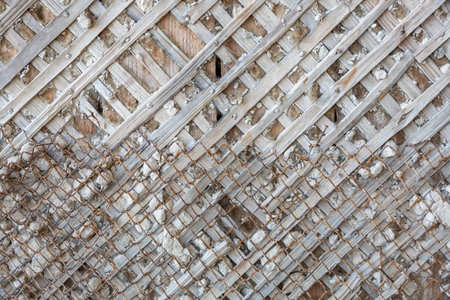 Textured surface of part of an old wooden wall before strengthening, leveling and finishing