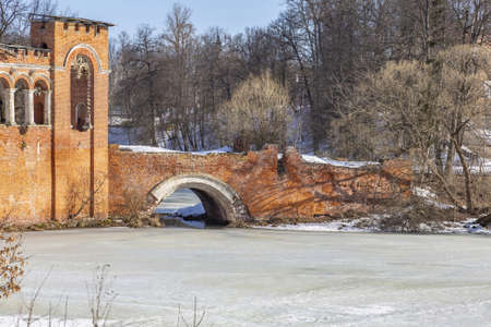 Marfino, Dmitrovsky district, Russia - March 28, 2021: Part of the abandoned facade of the manor. Pseudo-Gothic of the 18th century. Object of the cultural heritage of the peoples of the Russian Federationのeditorial素材