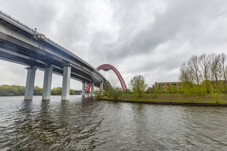 Moscow, Russia - May 8, 2021: Zhivopisny bridge. A bright red cable-stayed structure across the...