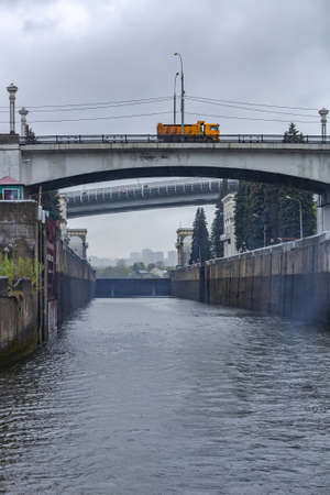 Moscow, Russia - May 8, 2021: Gateway on the Moskva River for adjusting the water level in the riverbed on a cloudy rainy dayのeditorial素材