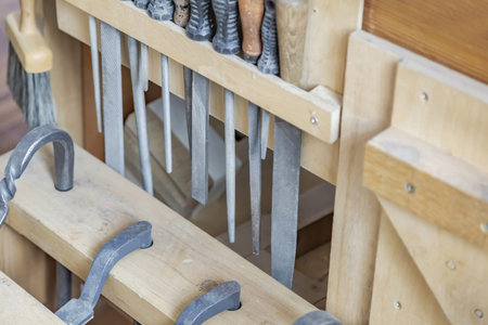 Mechanical working tool in a carpentry workshop. Manual production of wood and precious woods...