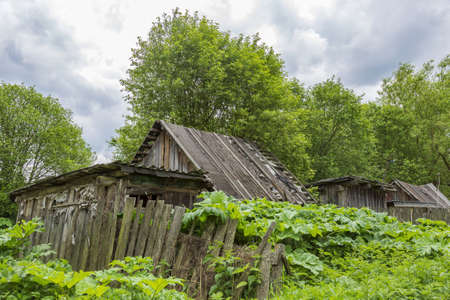 Part of the ruined facade of an abandoned old rural building in a remote villageの写真素材