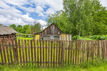 Part of the ruined facade of an abandoned old rural building in a remote villageの写真素材
