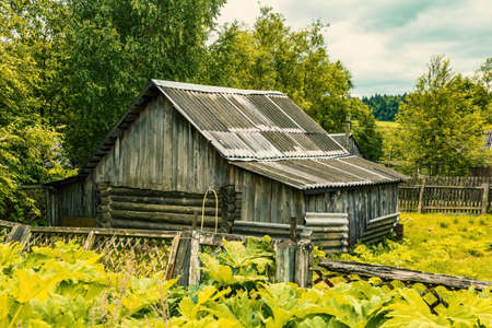 Part of the ruined facade of an abandoned old rural building in a remote villageの写真素材