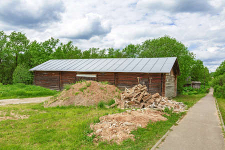 Part of the ruined facade of an abandoned old rural building in a remote villageの写真素材