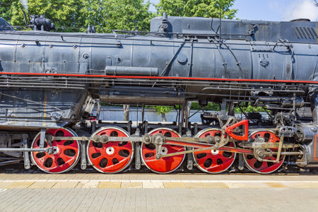 Moscow, Russia - July 11, 2021: Black retro steam locomotive on the railway platform of the Rizhsky...