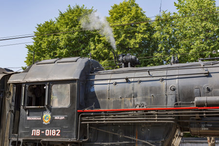 Moscow, Russia - July 11, 2021: Black retro steam locomotive on the railway platform of the Rizhsky...