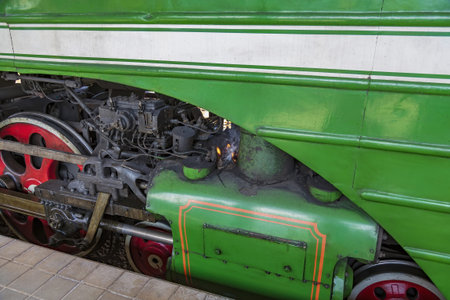 Moscow, Russia - July 11, 2021: Green retro steam locomotive on the railway platform of the Rizhsky...