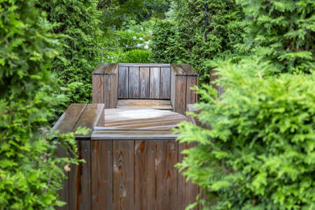 Handmade furniture made of wooden boards. Idea for landscaping the garden and backyardの写真素材