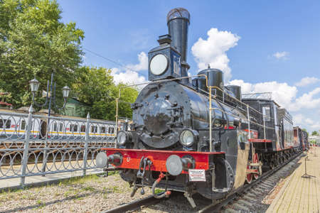 Moscow, Russia - August 14, 2021: Rare black retro steam locomotive. Exposition area of RZD railway vehicles at Rizhskaya stationのeditorial素材