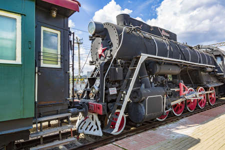 Moscow, Russia - August 14, 2021: Rare black retro steam locomotive. Exposition area of RZD railway vehicles at Rizhskaya stationのeditorial素材