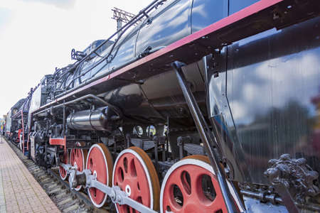 Moscow, Russia - August 14, 2021: Rare black retro steam locomotive. Exposition area of RZD railway vehicles at Rizhskaya stationのeditorial素材