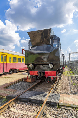 Moscow, Russia - August 14, 2021: Rare black retro steam locomotive. Exposition area of RZD railway vehicles at Rizhskaya stationのeditorial素材
