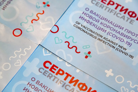 Moscow, Russia - August 27, 2021: City Certificate of vaccination against the novel coronavirus infection Covid-19. Inscriptions in Russianのeditorial素材