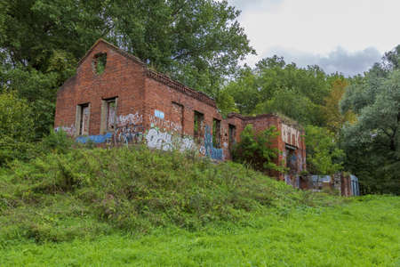 Mozhaysk, Russia - September 4, 2021: Ruined building of an old brick water pumping station in the Riviera city park. Built in 1870のeditorial素材