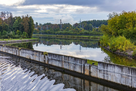 Scenic river landscape with green trees in early autumnの写真素材