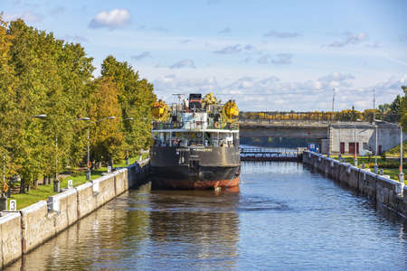 Uglich, Russia - September 11, 2021: Gateway on the Volga river for adjusting the water level in the riverbed on a sunny autumn day. Built in 1941のeditorial素材