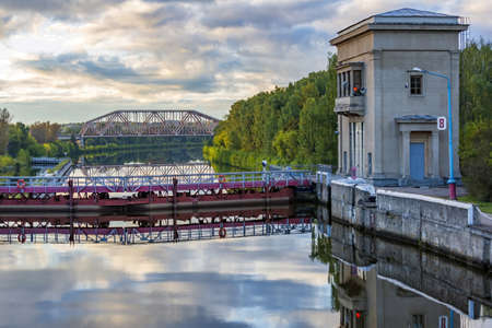 Moscow region, Russia - September 10, 2021: An old gateway on the Moscow Canal for adjusting the water level in the riverbed. A suburb of the capitalのeditorial素材