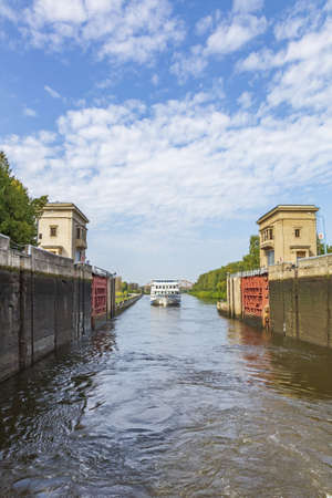 Moscow region, Russia - September 10, 2021: An old gateway on the Moscow Canal for adjusting the water level in the riverbed. A suburb of the capitalのeditorial素材