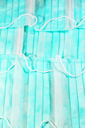 Non-sterile disposable medical mask with elastic bands. Made of non-woven materials. Multi - layered