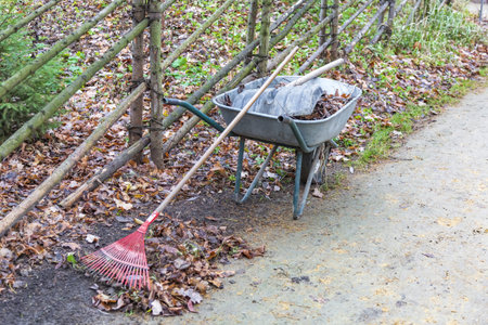 Iron wheel barrow for moving of building materials in the garden and in the backyardの写真素材