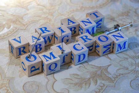 Wooden cubes with word Omicron in blue letters