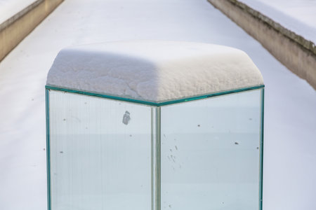 Large glass transparent cube as an element of garden or courtyard decorationの写真素材