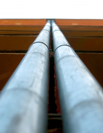 Two gutters perspective straight to the skyの写真素材