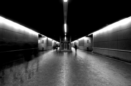 Blur Motion of people walking in a underground tunnelの写真素材