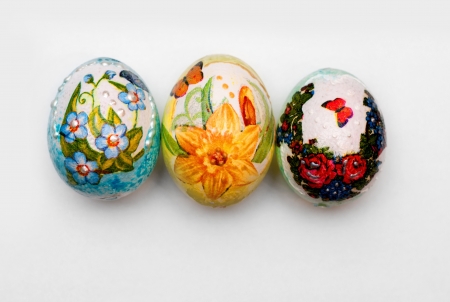 three handmade easter eggs isolatedの写真素材