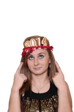 Attractive young woman with new year 2014 on headの写真素材