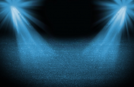 Blue cold light soccer field, bright spotlights, illuminated stadiumの写真素材