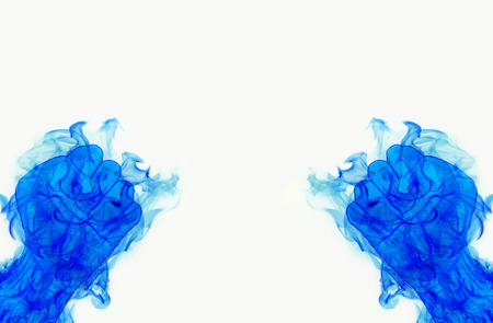 two blue fire flames fist on whiteの写真素材